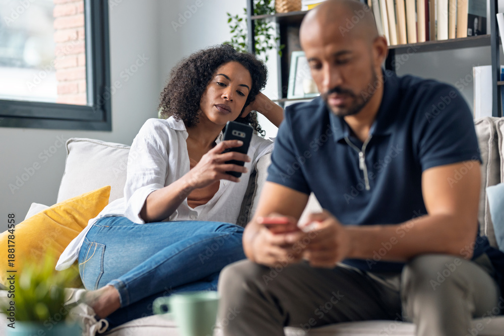 Couple sitting apart, emotionally distant
